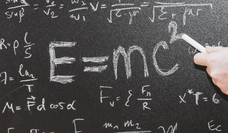 E=MC squared on chalkboard