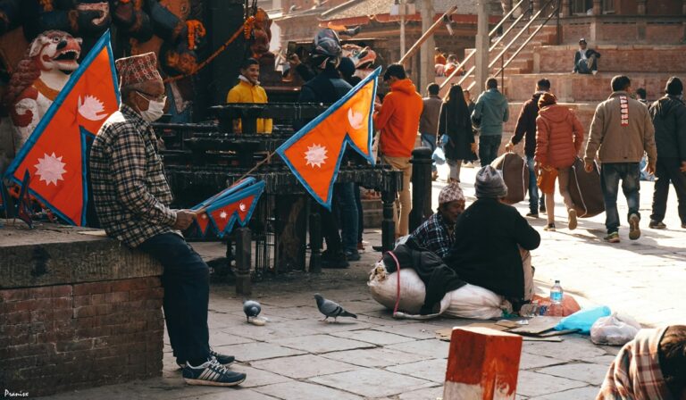 People holding Nepalese flags