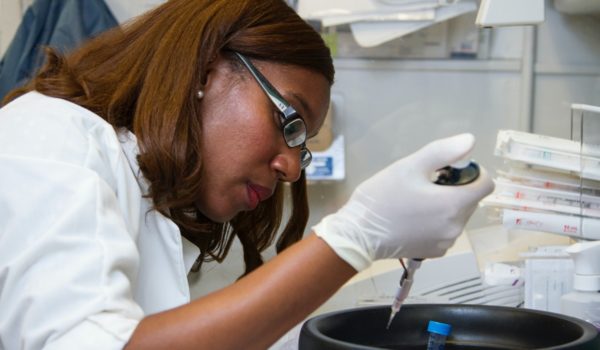 Woman working with pipet