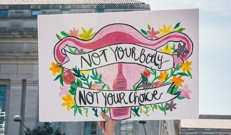 "Not Your Body, Not Your Choice" sign