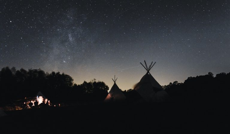 Tepees and fire at night