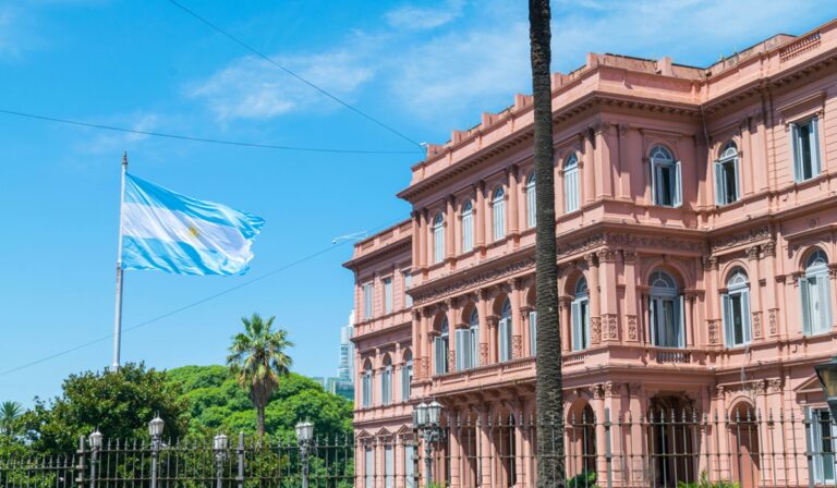 Argentinian flag flying near a building