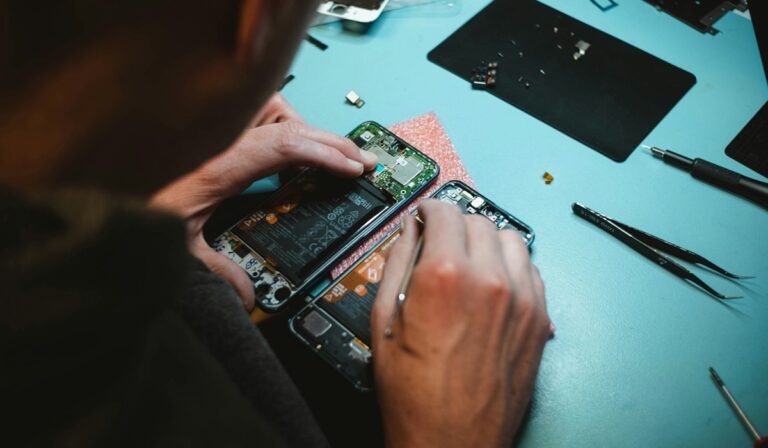 Person repairing smart phone