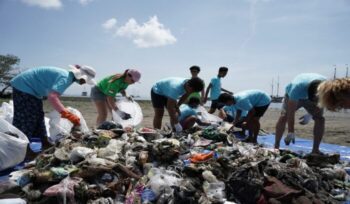 A group of people cleaning the beach in Bali