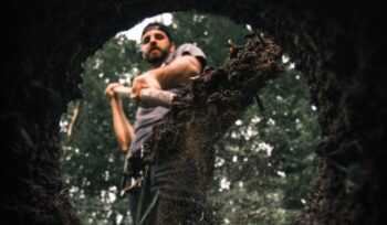 A man filling ground