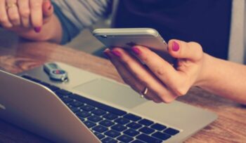 A woman holding an iphone