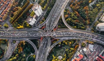 Aerial view of Shanghai traffic|Electric vehicle symbol on pavement