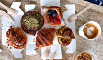 Assorted breakfast cakes with wooden utensils