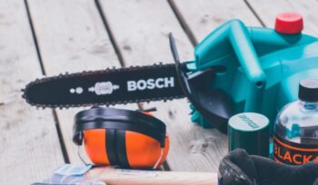 Bosch chainsaw and other work gear on a deck|abosch