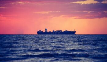 Cargo ship at sunset