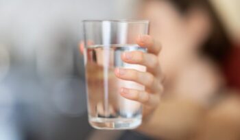 Holding a glass of water