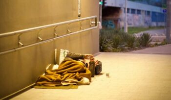 Homeless person lying on the ground