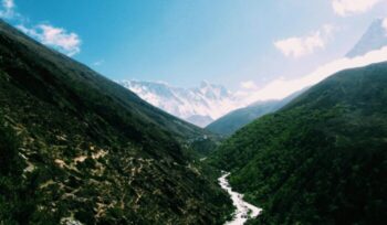 Nepal river valley with mountains in background