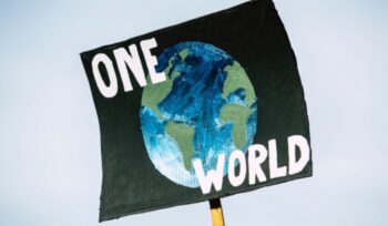 "One World" sign