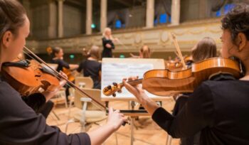 Orchestra members playing violin