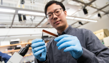 Scientist holding new ultrathin pacemaker