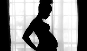 Silhouette of pregnant woman|A pregnant woman