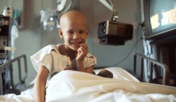 Young girl receiving chemotherapy